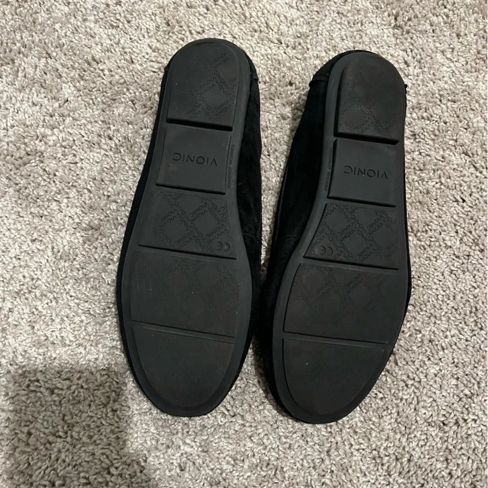 Vionic black suede Mesa loafers with gunmetal/muted silver chain accent